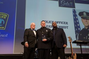Eric Schmidt receives the Police Officer of the Year Award.